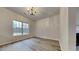 Bright dining room features hardwood floors and a chandelier at 2801 Varnish Pl, Raleigh, NC 27610