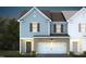 Two-story townhome with light blue and brown siding, white garage door, and landscaping at 291 Broomside Ave, Raleigh, NC 27603