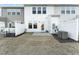 Private backyard with grassy area, a patio, and a white fence at 31 Burford Way, Angier, NC 27501