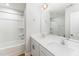 Clean bathroom with double vanity, a large mirror, and a shower/tub combo at 31 Burford Way, Angier, NC 27501