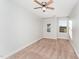 Spacious bedroom with neutral wall paint, plush carpeting, and two bright windows at 31 Burford Way, Angier, NC 27501
