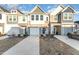 Two story townhome with attached garage and landscaped yard at 31 Burford Way, Angier, NC 27501