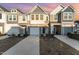 Two story townhome with attached garage and landscaped yard at 31 Burford Way, Angier, NC 27501