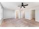 Large main bedroom with plush carpeting, an ensuite bathroom, and walk-in closet at 31 Burford Way, Angier, NC 27501