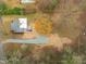 Aerial view showing a house and large lot, newly graveled driveway at 320B W Orange St, Hillsborough, NC 27278