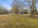 Backyard with mature trees and a shed at 320B W Orange St, Hillsborough, NC 27278