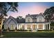 Two-story farmhouse with dark roof, white siding, and front porch at 320B W Orange St, Hillsborough, NC 27278
