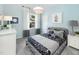 Light blue bedroom with gray star bedding, window seat, and gray accents at 341 Broomside Ave, Raleigh, NC 27603