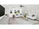 Spacious living room with light colored furniture, wood flooring, and plenty of natural light at 341 Broomside Ave, Raleigh, NC 27603