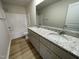 Bathroom with double vanity, granite countertop, and shower/tub combo at 39 Harvest Hills Ln, Dunn, NC 28334