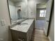 Bathroom with double vanity, granite countertop, and mirrored medicine cabinet at 39 Harvest Hills Ln, Dunn, NC 28334