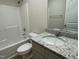 Bathroom with granite countertop and a shower/tub combo at 39 Harvest Hills Ln, Dunn, NC 28334