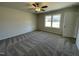 Bright bedroom with neutral walls, ceiling fan, and grey carpet at 39 Harvest Hills Ln, Dunn, NC 28334