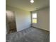 Bedroom with neutral decor, carpet, and a walk-in closet at 39 Harvest Hills Ln, Dunn, NC 28334