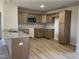 Modern kitchen with light wood cabinets and granite countertops at 39 Harvest Hills Ln, Dunn, NC 28334