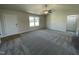Spacious living room with neutral carpet and a ceiling fan at 39 Harvest Hills Ln, Dunn, NC 28334