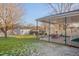 Covered patio area in the backyard with table and chairs at 505 Forrest St, Hillsborough, NC 27278