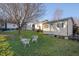 Backyard with shed and white chairs at 505 Forrest St, Hillsborough, NC 27278