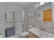 Clean bathroom with a shower/tub combo and tiled walls at 505 Forrest St, Hillsborough, NC 27278