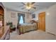 Cozy bedroom with double bed, dresser, and ceiling fan at 505 Forrest St, Hillsborough, NC 27278