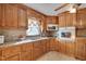 Galley kitchen with wood cabinets and granite countertops at 505 Forrest St, Hillsborough, NC 27278