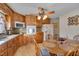 Kitchen features wood cabinets, granite counters, and a breakfast table at 505 Forrest St, Hillsborough, NC 27278