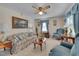 Living room with floral sofa and armchairs, creating a cozy atmosphere at 505 Forrest St, Hillsborough, NC 27278
