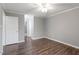 Spacious, neutral bedroom with hardwood floors and a ceiling fan at 514 New Kent Pl, Cary, NC 27511