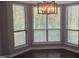 Bright dining area with natural light coming in through the windows and a modern chandelier at 514 New Kent Pl, Cary, NC 27511