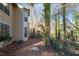 Side view of a building with trees, leaves and bushes surrounding it at 514 New Kent Pl, Cary, NC 27511