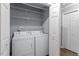 Laundry Room featuring washer, dryer, wire shelving for storage, and utility closet at 514 New Kent Pl, Cary, NC 27511