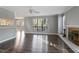 Living room with hardwood floors, fireplace and large windows at 514 New Kent Pl, Cary, NC 27511