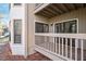 View of a wood patio featuring sliding glass doors, windows and white trim at 514 New Kent Pl, Cary, NC 27511