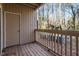 Exterior deck with wooden railing and a view of trees and nature at 514 New Kent Pl, Cary, NC 27511