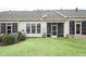 Private backyard with screened porch and grassy area at 524 Brunello Dr, Wake Forest, NC 27587