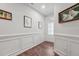 Bright and airy entryway with hardwood floors and wainscoting at 524 Brunello Dr, Wake Forest, NC 27587