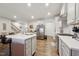 Modern kitchen with island, stainless steel appliances, and white cabinets at 524 Brunello Dr, Wake Forest, NC 27587