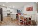 Modern kitchen with island, stainless steel appliances, and white cabinets at 524 Brunello Dr, Wake Forest, NC 27587