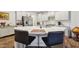 Large kitchen island with white quartz countertops and seating at 524 Brunello Dr, Wake Forest, NC 27587