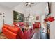 Spacious living room with red leather sofas, fireplace, and hardwood floors at 524 Brunello Dr, Wake Forest, NC 27587