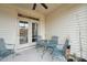 Relaxing screened porch with patio furniture and ceiling fan at 524 Brunello Dr, Wake Forest, NC 27587