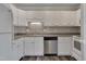 White kitchen with stainless steel appliances and tile backsplash at 5500 Fortunes Ridge Dr # 67B, Durham, NC 27713