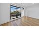 Private balcony with black railings offers a view of a tree-lined neighborhood at 615 Daniels St # 316, Raleigh, NC 27605