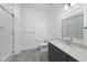 Modern bathroom featuring a tiled shower, vanity with sink, and stylish fixtures at 615 Daniels St # 316, Raleigh, NC 27605