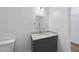 Modern bathroom featuring vanity with stone countertop and stylish mirror at 615 Daniels St # 316, Raleigh, NC 27605