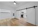 Bedroom with hardwood floors, closet, and slider to a kitchen area at 615 Daniels St # 316, Raleigh, NC 27605