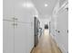 Modern open kitchen with stainless steel appliances and white cabinets, and hardwood floors at 615 Daniels St # 316, Raleigh, NC 27605