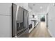 Modern kitchen with stainless steel appliances, white cabinets, and a quartz countertop at 615 Daniels St # 316, Raleigh, NC 27605