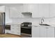 Modern kitchen featuring stainless steel appliances, white cabinets, and granite countertops at 615 Daniels St # 316, Raleigh, NC 27605