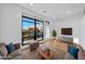 Bright living room featuring hardwood floors, a large window, and neutral-toned furniture at 615 Daniels St # 316, Raleigh, NC 27605